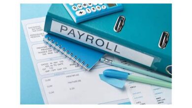 Small business owner using laptop for payroll